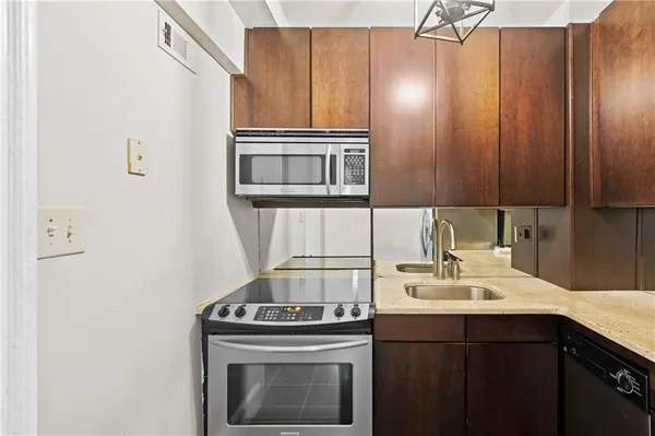 a kitchen with a stove and a sink