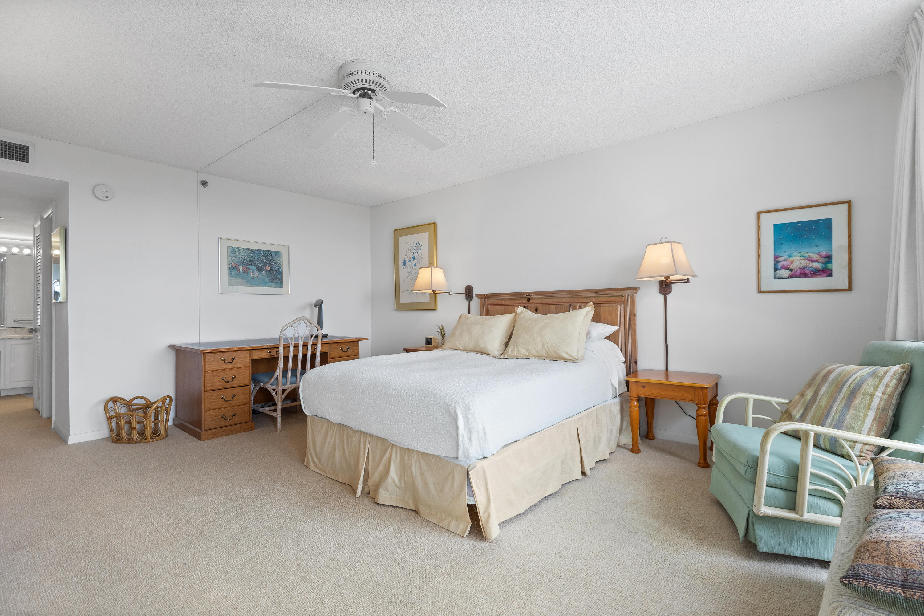 4750 South Ocean Boulevard, Unit 409 Highland Beach, FL 33487 - Photo 14 of 26 a bedroom with bed and a chandelier