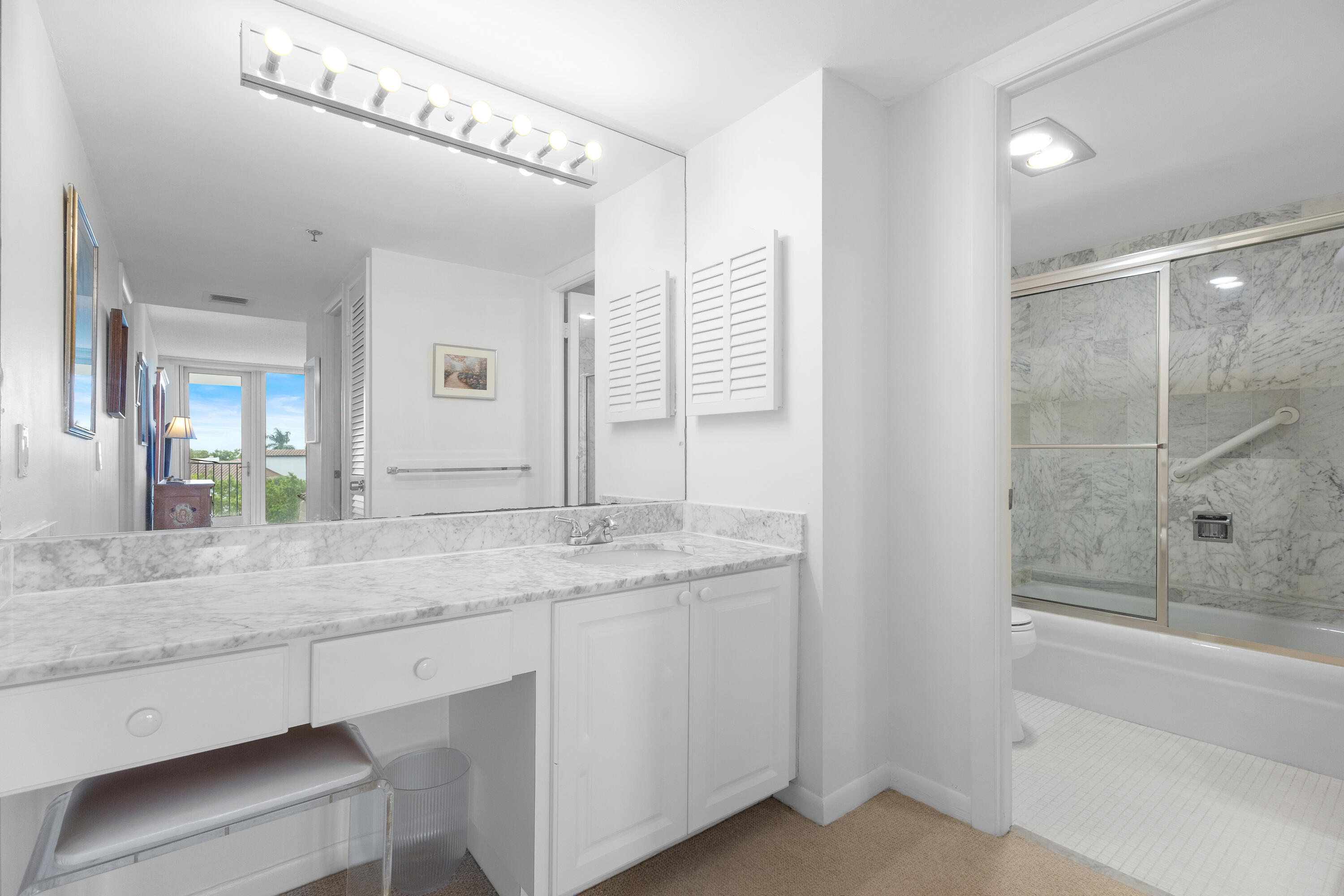 4750 South Ocean Boulevard, Unit 409 Highland Beach, FL 33487 - Photo 15 of 26 a bathroom with a granite countertop sink mirror and double