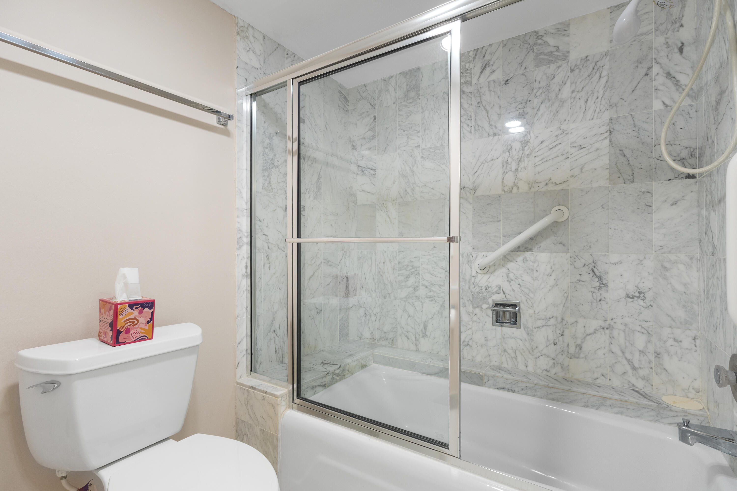 4750 South Ocean Boulevard, Unit 409 Highland Beach, FL 33487 - Photo 16 of 26 a bathroom with a toilet and a shower