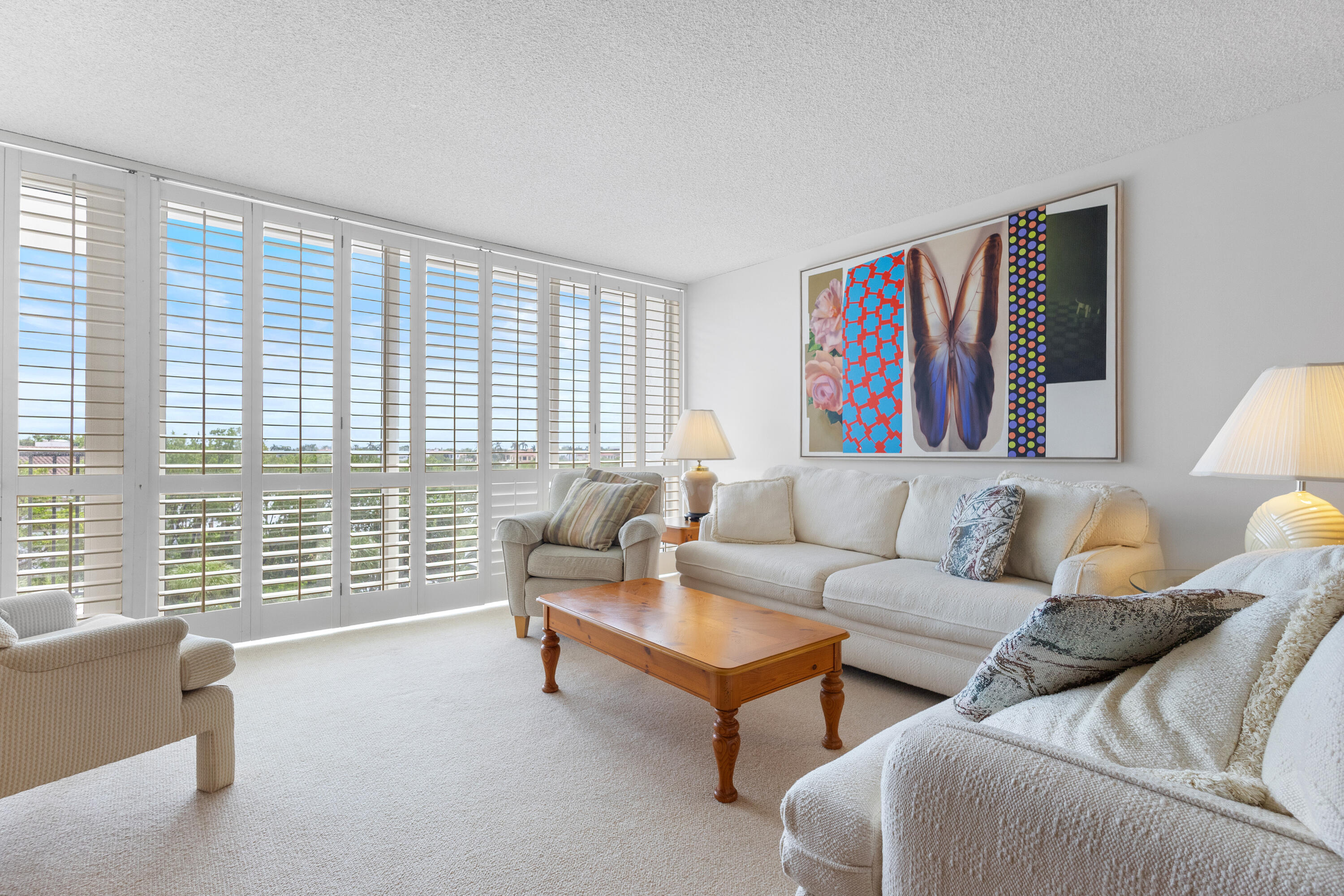 4750 South Ocean Boulevard, Unit 409 Highland Beach, FL 33487 - Photo 6 of 26 a living room with furniture and a large window