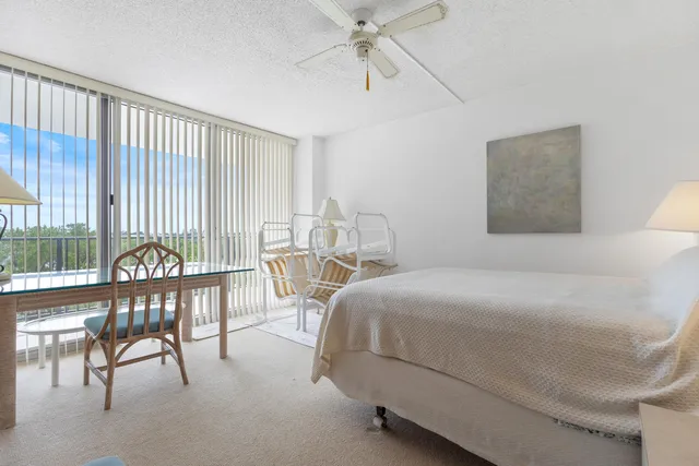 a bedroom with a bed and a table