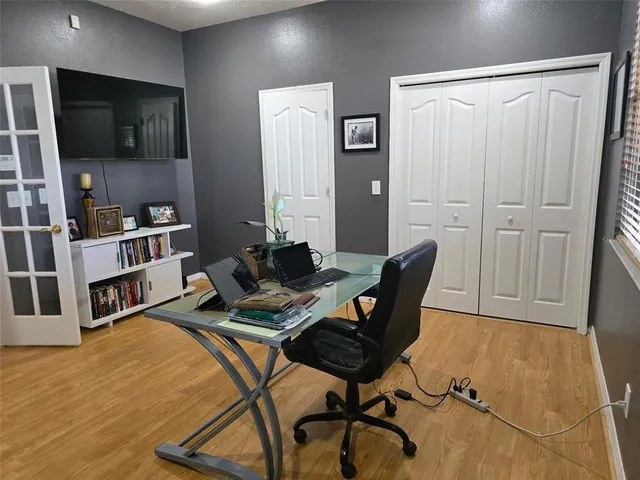 a workspace with furniture and wooden floor