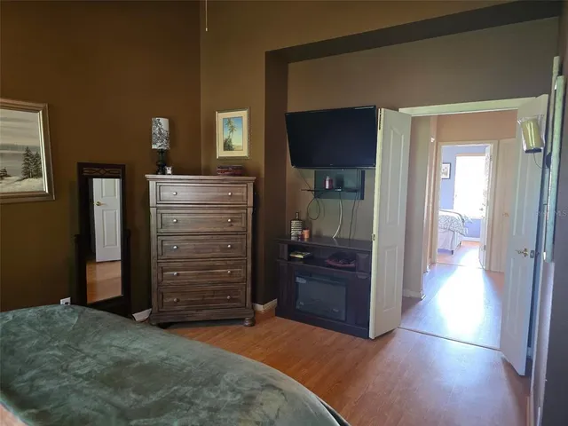 a view of room with a flat tv screen and a dresser