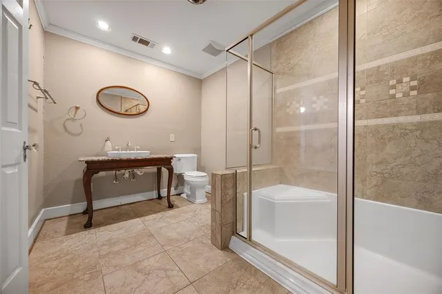 a bathroom with a sink a glass door shower and a mirror