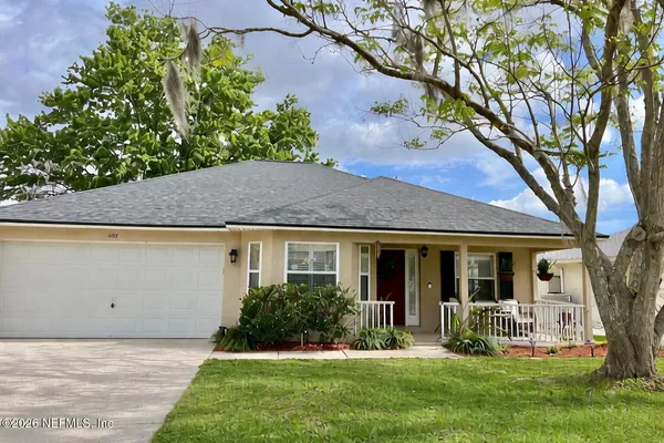 front view of a house with a yard