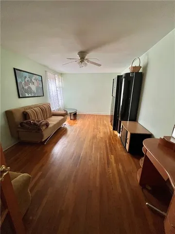 a view of a living room and hardwood floor
