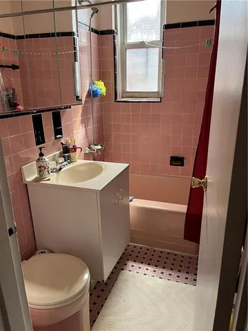 a bathroom with a sink toilet and tub