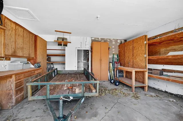 a room with lots of wooden cabinets