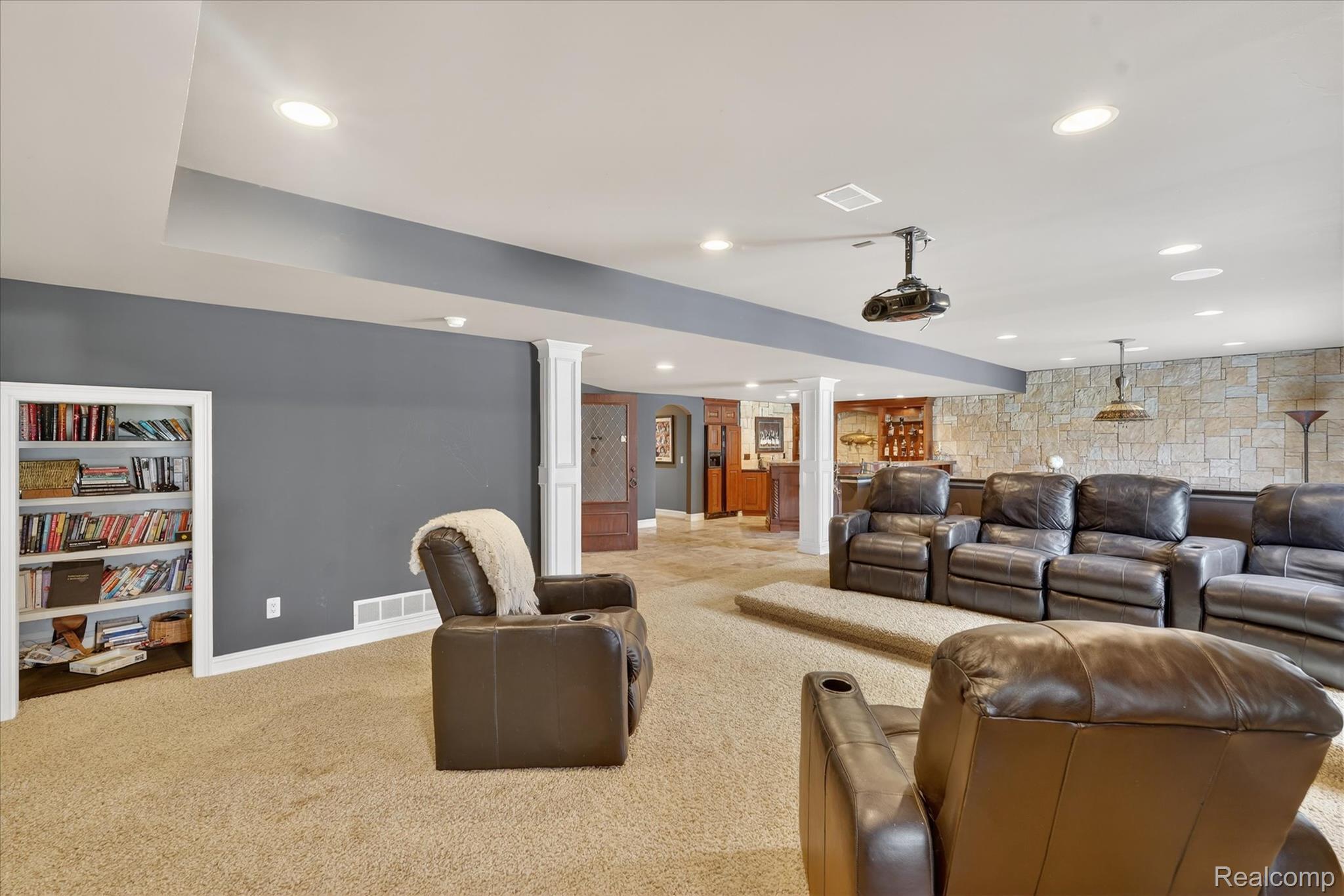 6932 Oakhurst Ridge Road Clarkston, MI 48348 - Photo 48 of 78 Carpeted cinema room featuring an accent wall, ornate columns, and recessed lighting