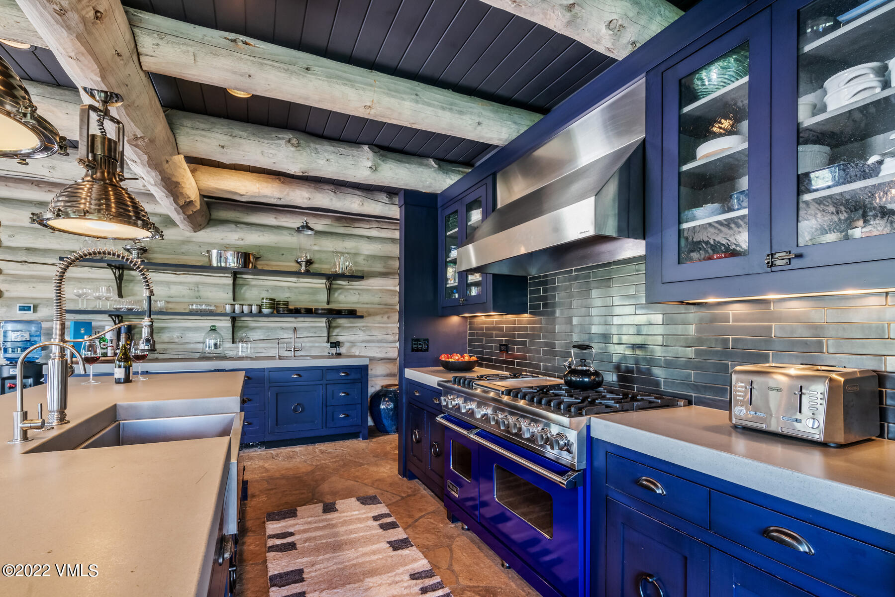 1145 Pilgrim Drive Edwards, CO 81632 - Photo 11 of 54 a kitchen with stainless steel appliances granite countertop a stove and a wooden cabinets