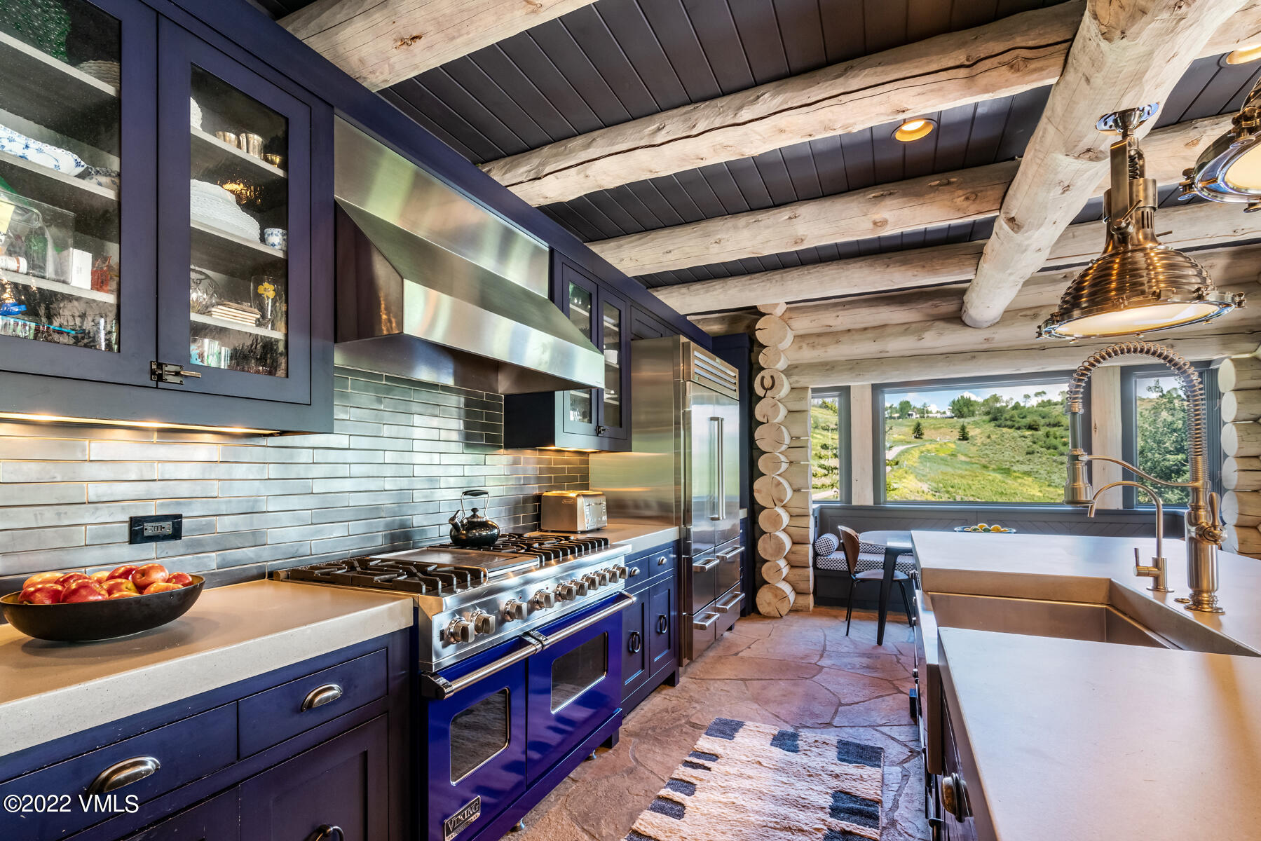 1145 Pilgrim Drive Edwards, CO 81632 - Photo 12 of 54 a kitchen with stainless steel appliances granite countertop a stove a sink dishwasher and cabinets with wooden floor
