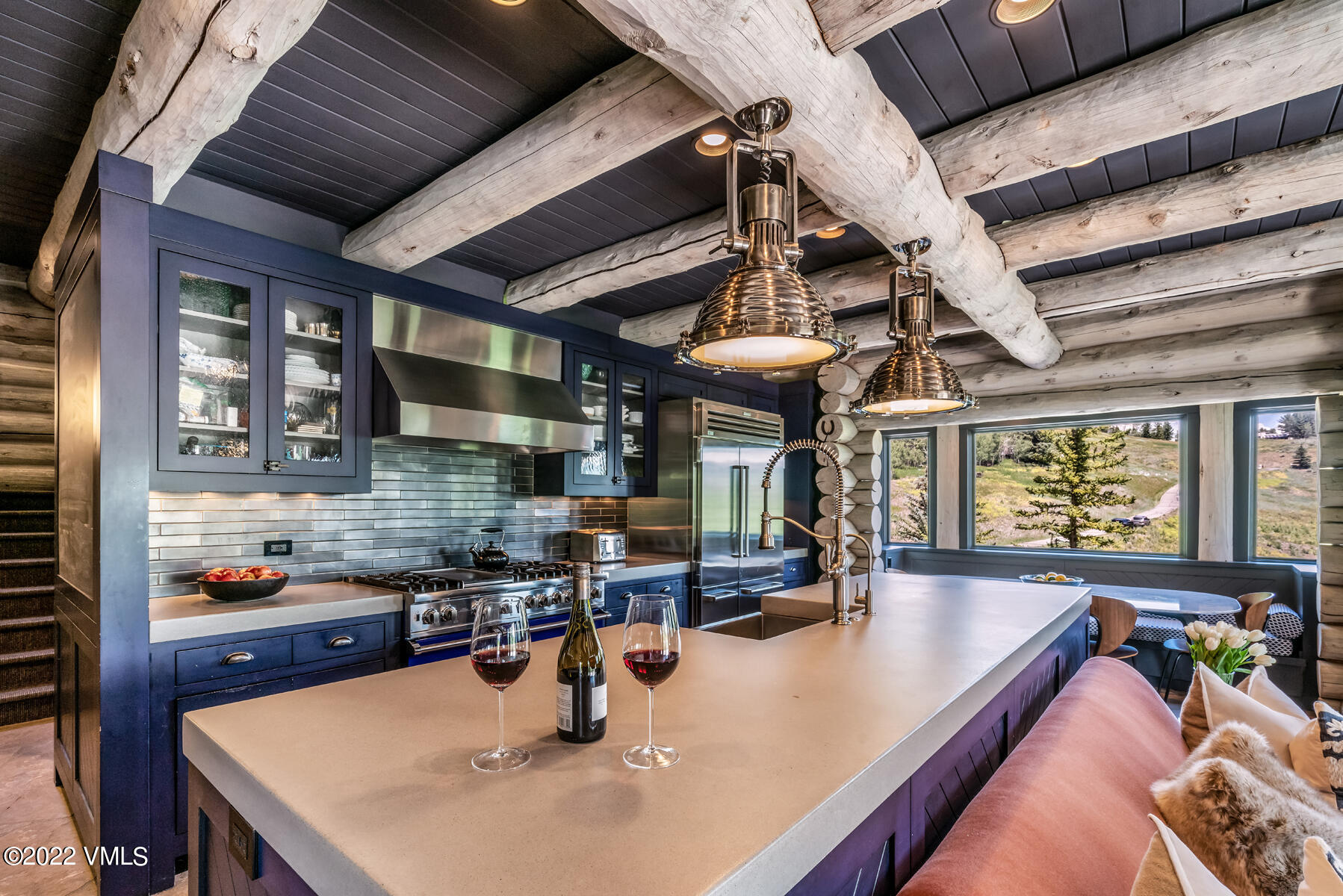 1145 Pilgrim Drive Edwards, CO 81632 - Photo 14 of 54 a kitchen with a table chairs stove and wooden floor