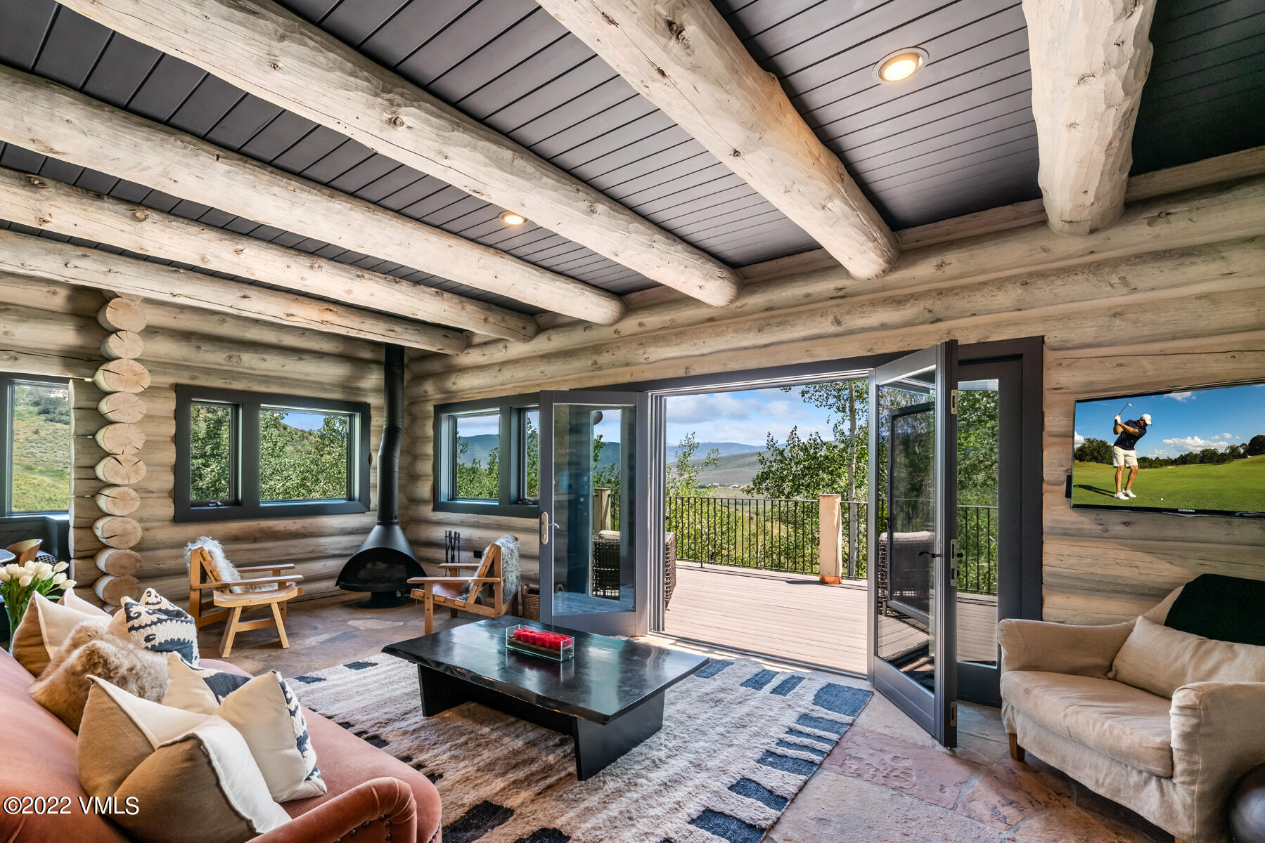 1145 Pilgrim Drive Edwards, CO 81632 - Photo 17 of 54 a living room with furniture and floor to ceiling windows