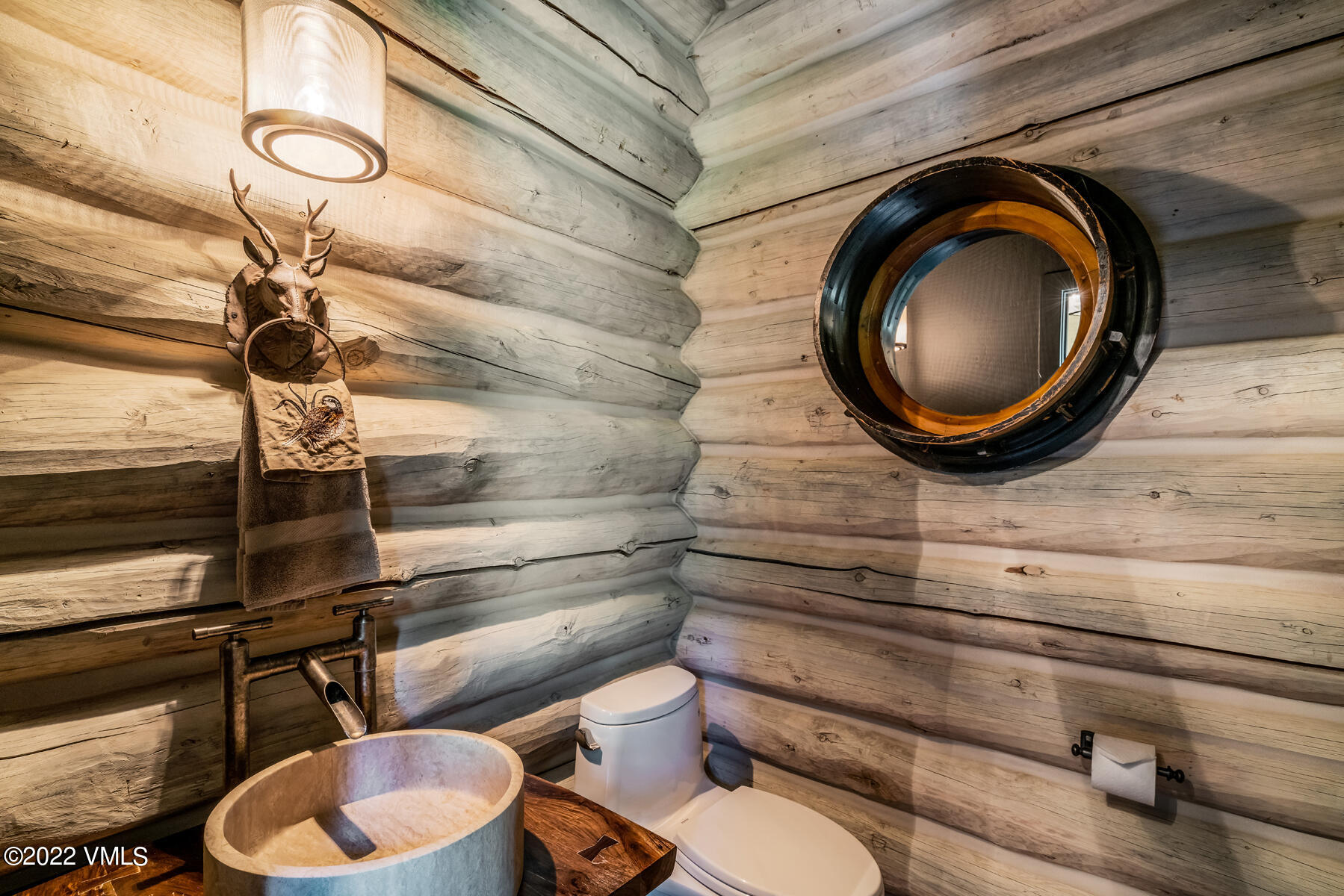 1145 Pilgrim Drive Edwards, CO 81632 - Photo 22 of 54 a bathroom with a toilet and a mirror