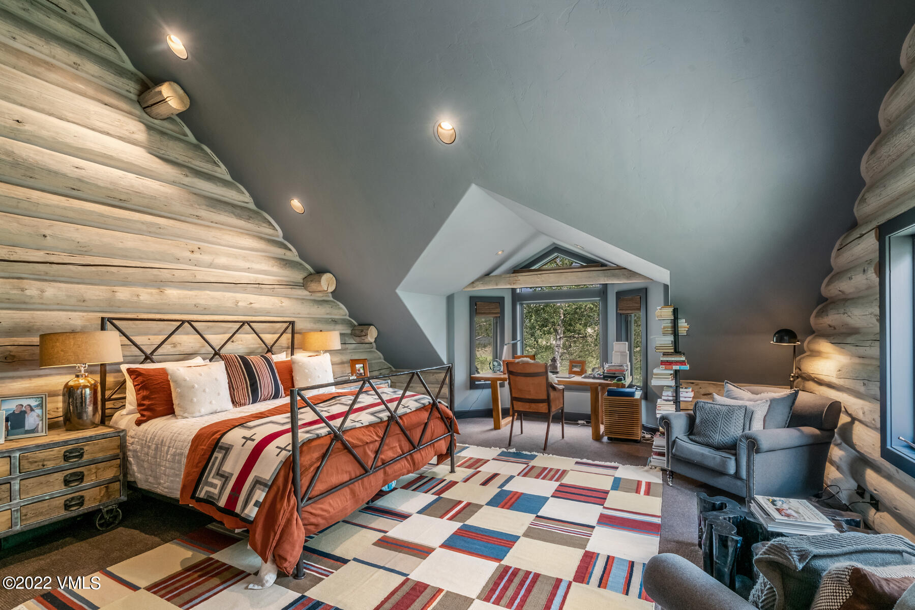 1145 Pilgrim Drive Edwards, CO 81632 - Photo 25 of 54 a bedroom with furniture and a fireplace