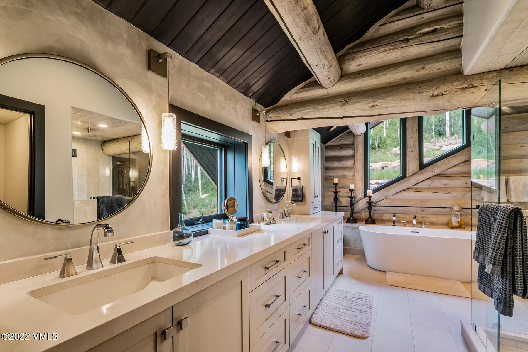 1145 Pilgrim Drive Edwards, CO 81632 - Photo 27 of 54 a spacious bathroom with a double vanity sink a mirror and a bathtub