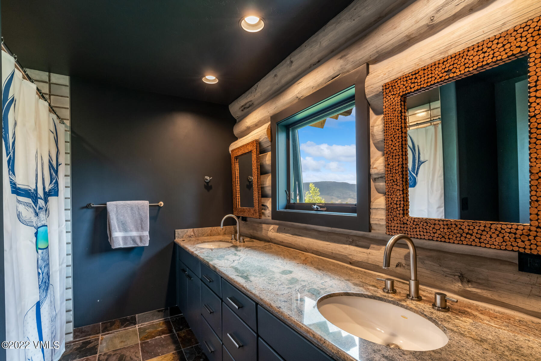 1145 Pilgrim Drive Edwards, CO 81632 - Photo 34 of 54 a bathroom with a sink and a mirror