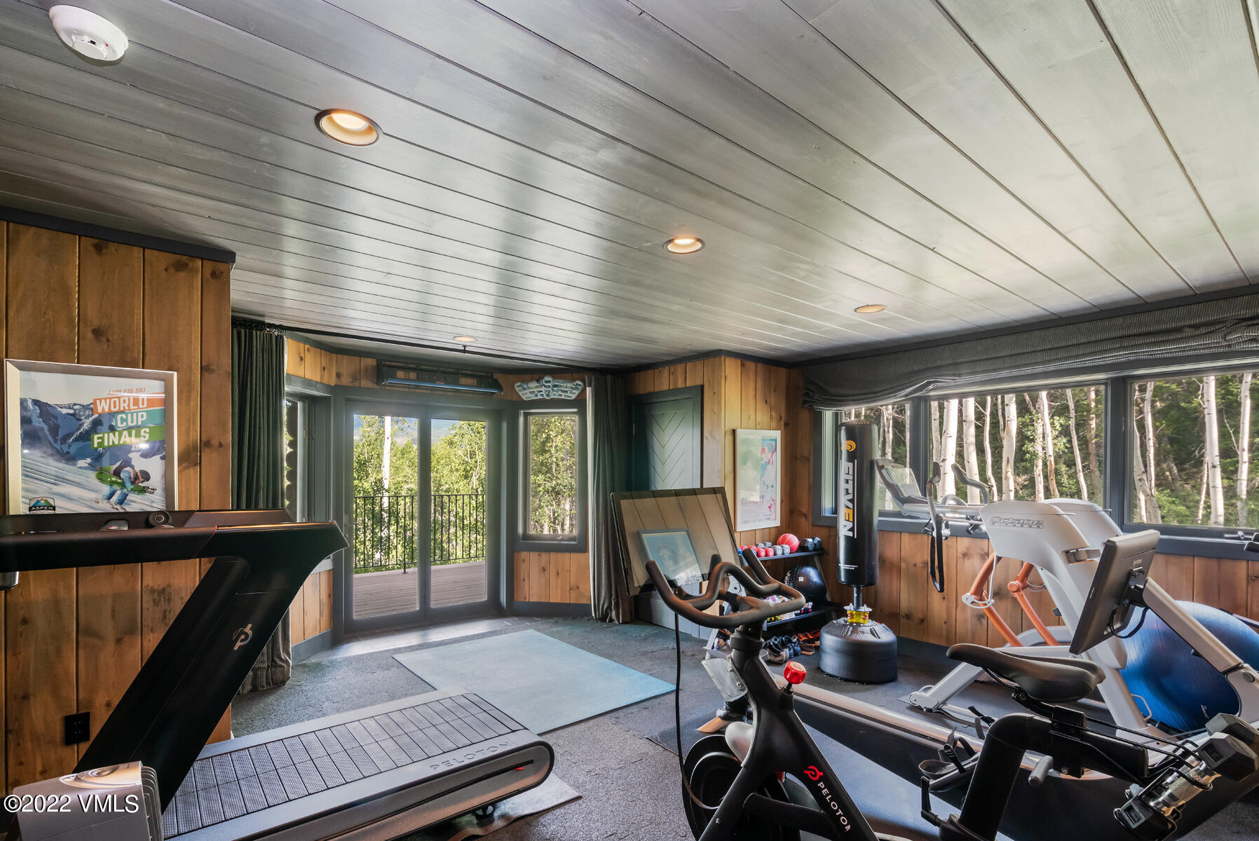 1145 Pilgrim Drive Edwards, CO 81632 - Photo 41 of 54 a living room with furniture a flat screen tv and a large window