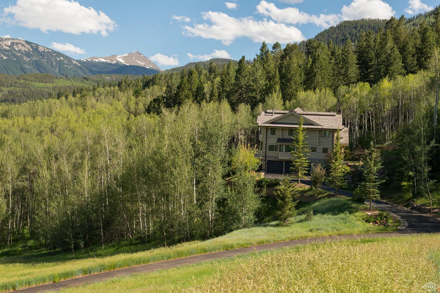 1145 Pilgrim Drive Edwards, CO 81632 - Photo 49 of 54 a view of a lake with a mountain in the background