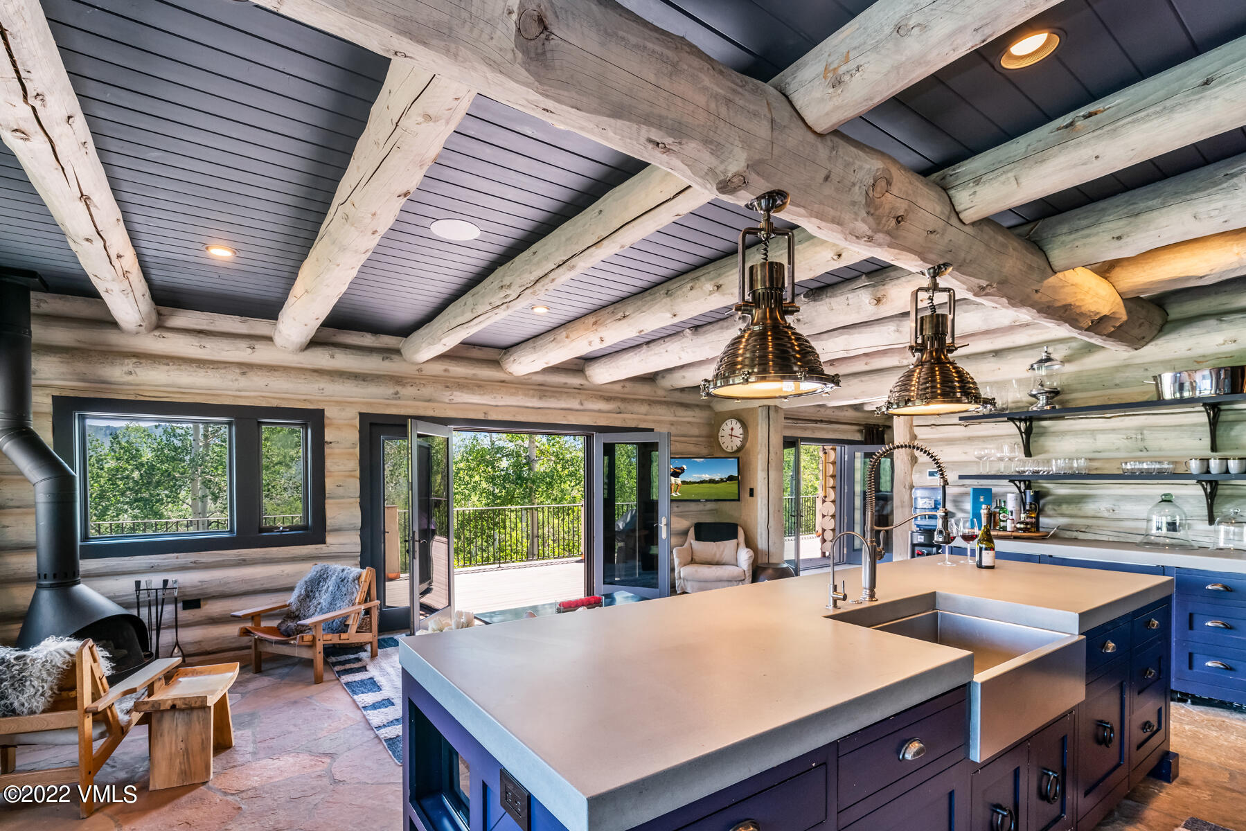 1145 Pilgrim Drive Edwards, CO 81632 - Photo 10 of 54 a view of a dining room with furniture water view and a fireplace