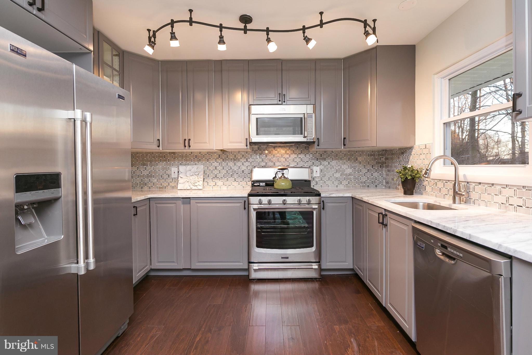 630 Hornbeam Road Edgewood, MD 21040 - Photo 1 of 29 a kitchen with a refrigerator sink and cabinets
