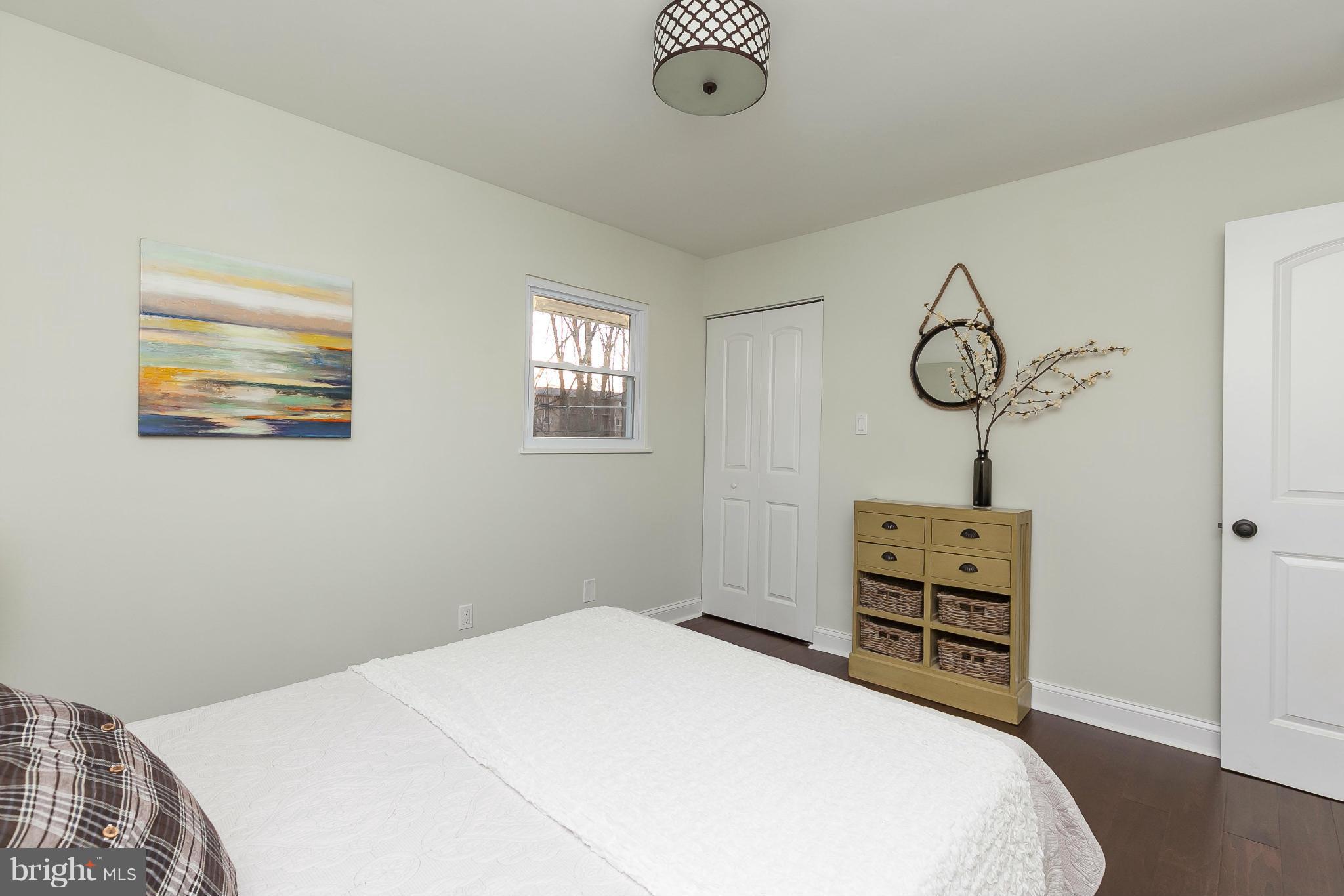 630 Hornbeam Road Edgewood, MD 21040 - Photo 14 of 29 a bedroom with a bed and a chandelier