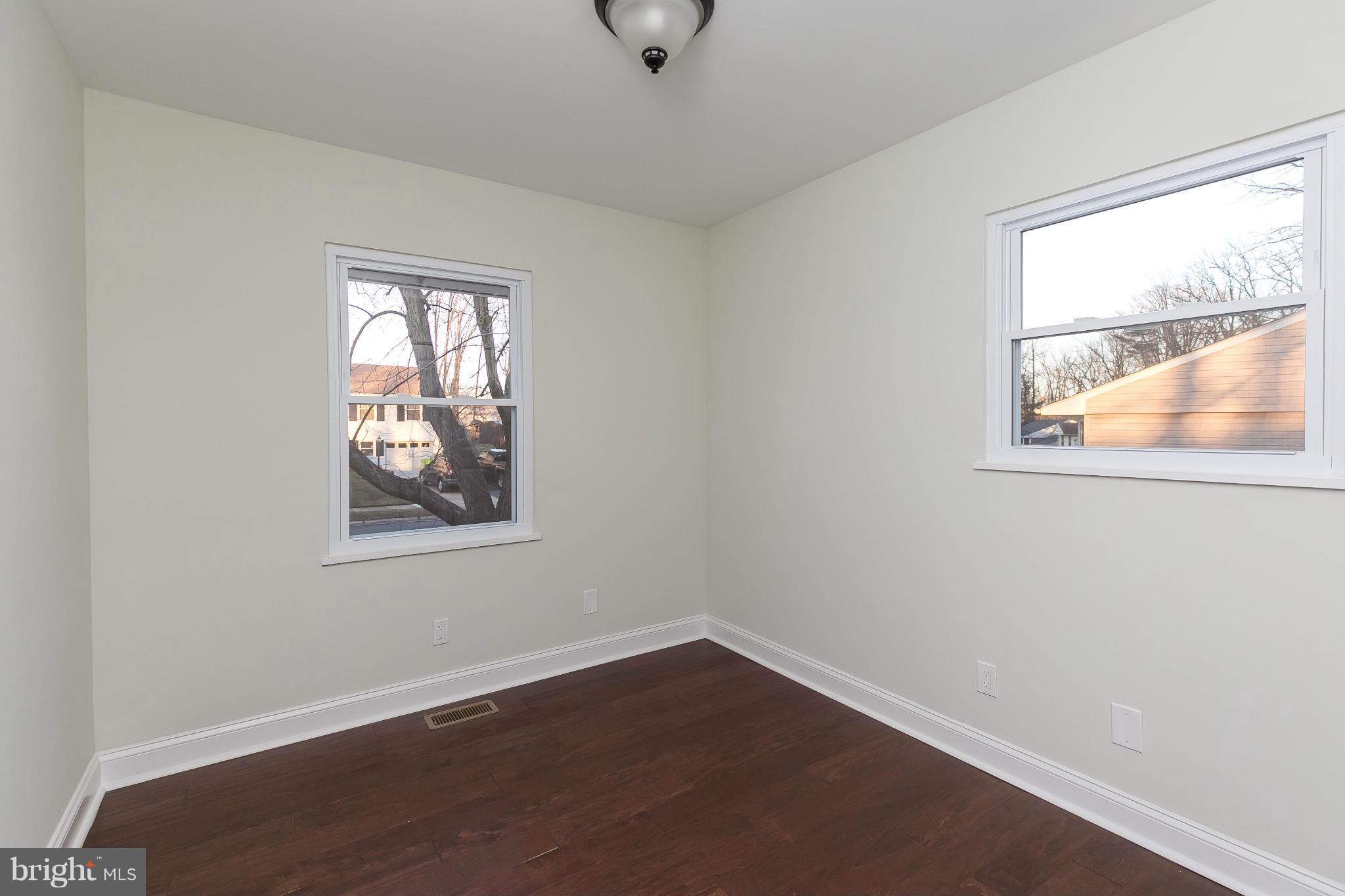 630 Hornbeam Road Edgewood, MD 21040 - Photo 17 of 29 an empty room with wooden floor and windows