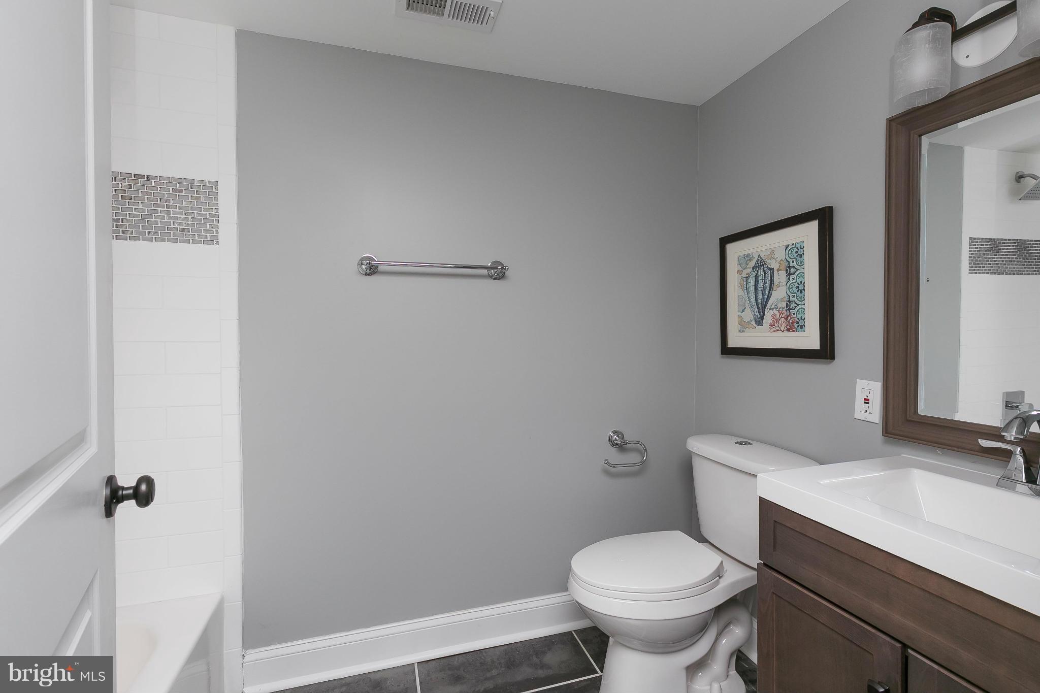 630 Hornbeam Road Edgewood, MD 21040 - Photo 23 of 29 a white toilet sitting next to a bathroom sink