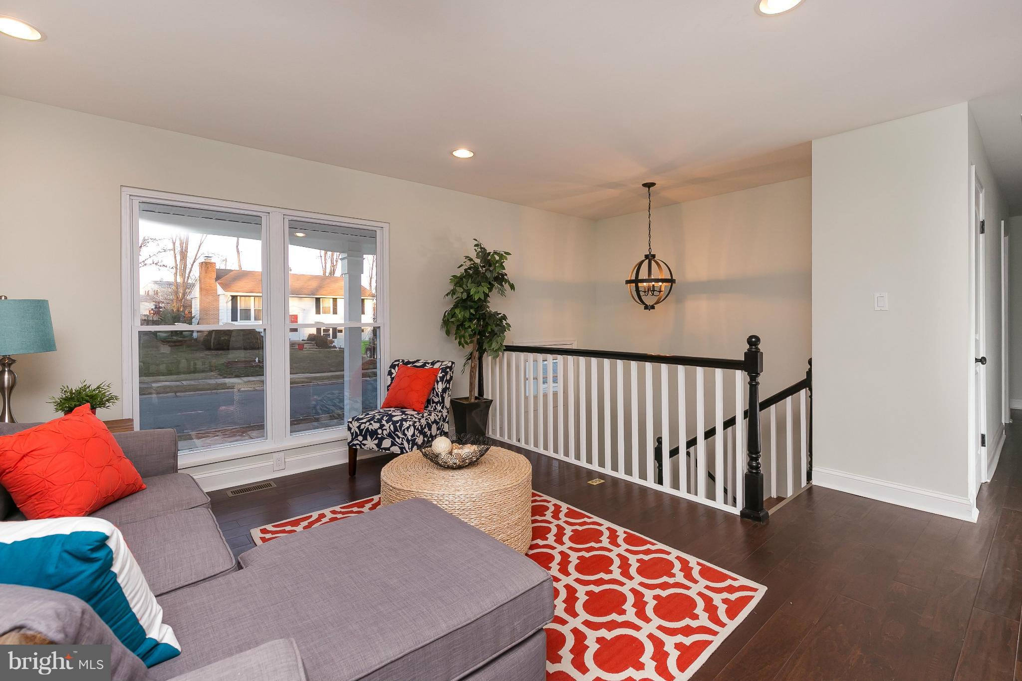 630 Hornbeam Road Edgewood, MD 21040 - Photo 5 of 29 a hallway with a couch and a potted plant