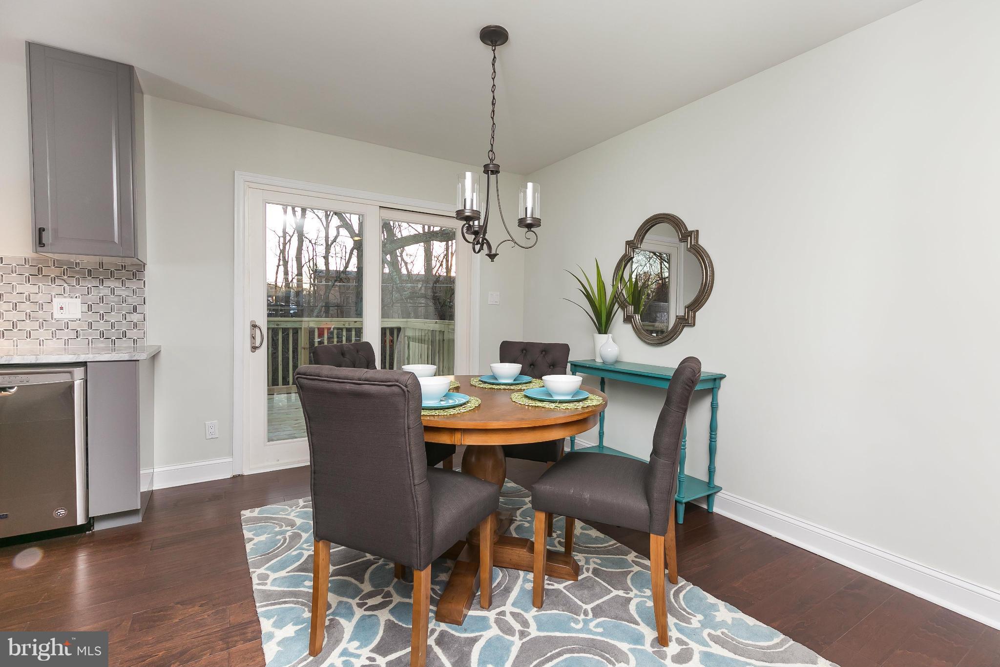 630 Hornbeam Road Edgewood, MD 21040 - Photo 8 of 29 a dining room with furniture a chandelier and wooden floor