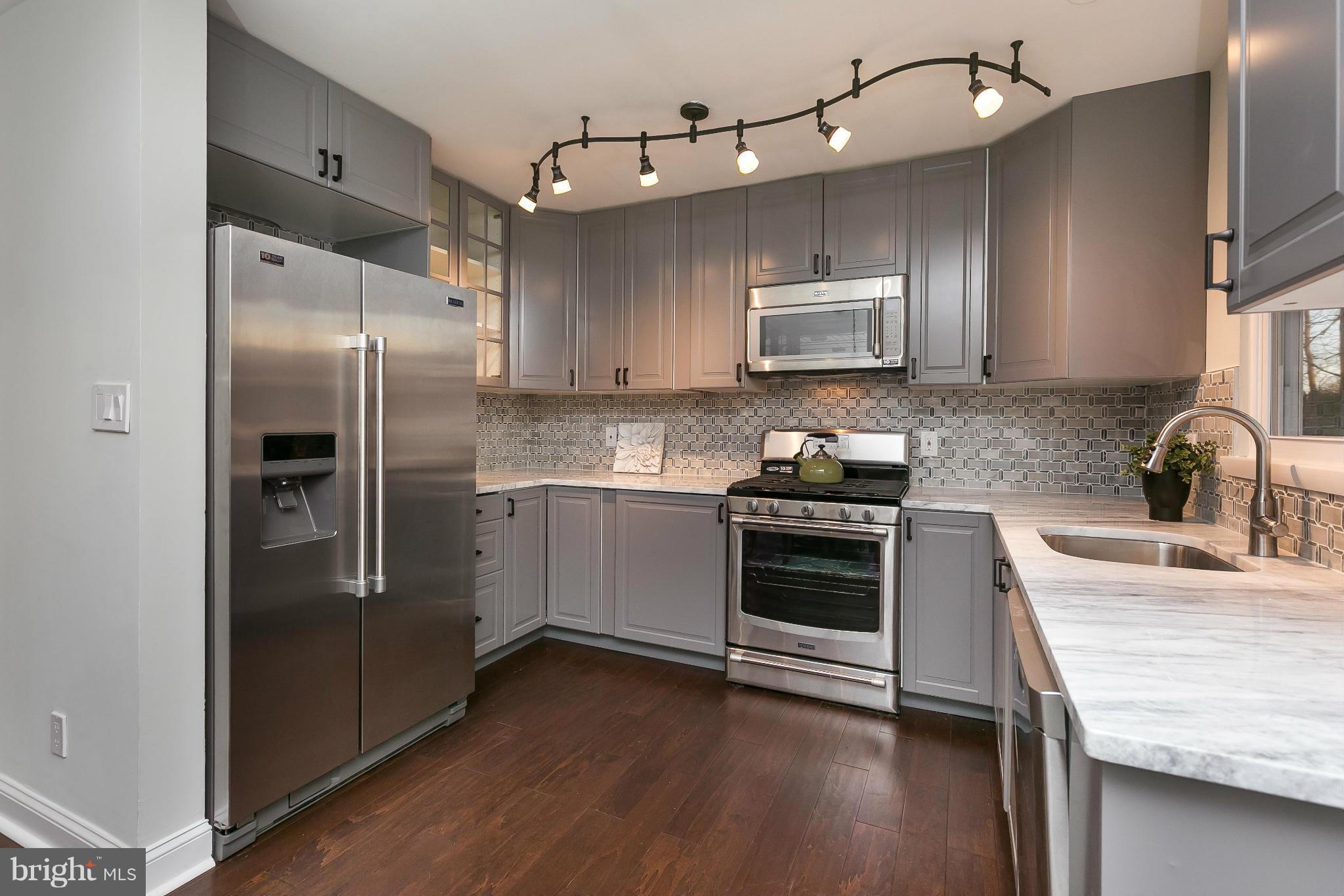 630 Hornbeam Road Edgewood, MD 21040 - Photo 9 of 29 a kitchen with stainless steel appliances granite countertop a refrigerator a stove a sink and a microwave
