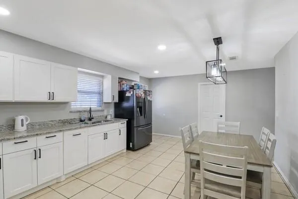 a kitchen with a sink appliances and cabinets