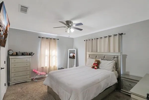 a bedroom with a bed and a closet