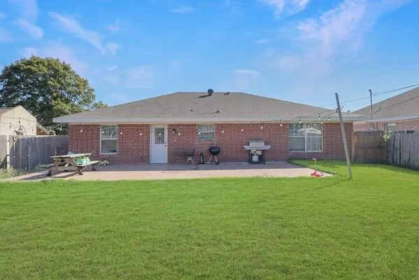 a front view of a house with swimming pool having outdoor seating