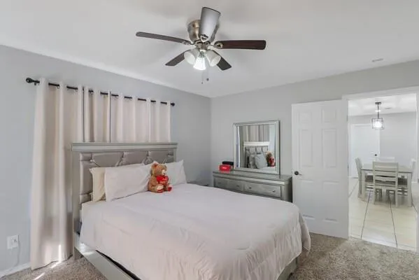 a bedroom with a bed and a table