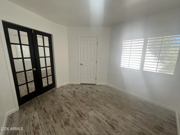 a living room with furniture a ceiling fan and a flat screen tv