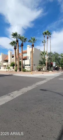 a view of kitchen with granite countertop stainless steel appliances and cabinets