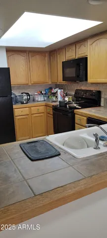 a view of kitchen with furniture and stove