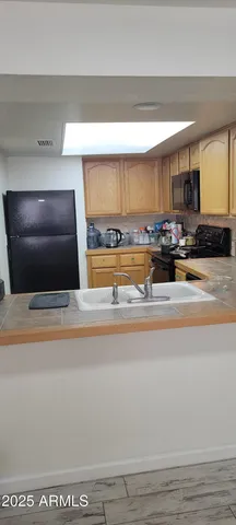 a bathroom with a vanity and a mirror