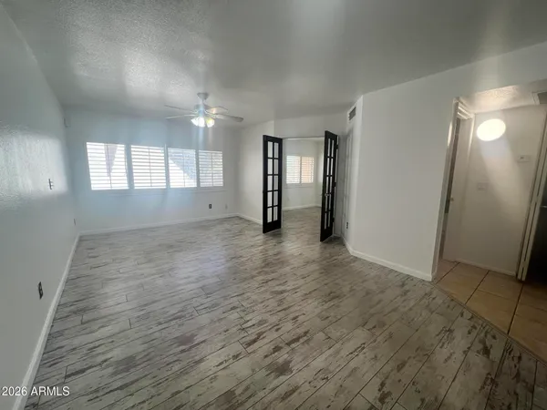 a bathroom with a sink a large mirror and a bathtub