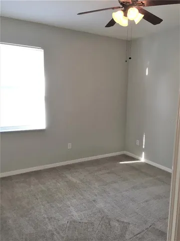 an empty room with fan