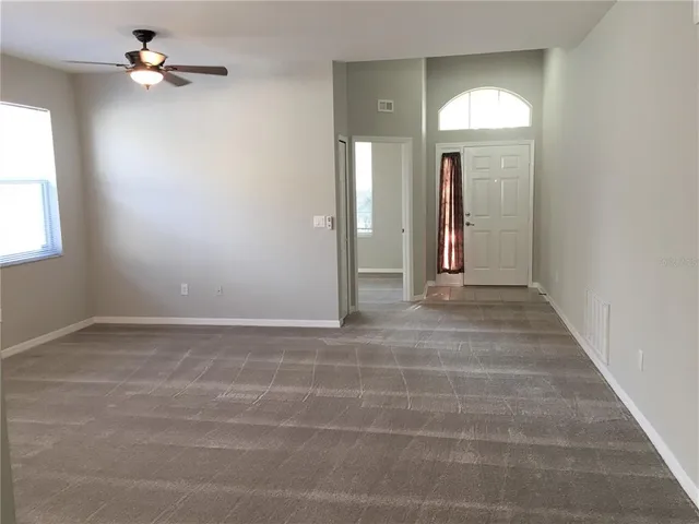 a kitchen with a sink a counter top space cabinets and stainless steel appliances