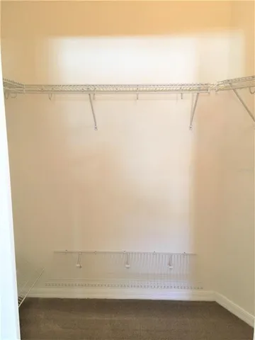 a bathroom with a shower sink and mirror