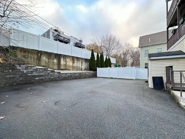 a view of a house with a white roof deck