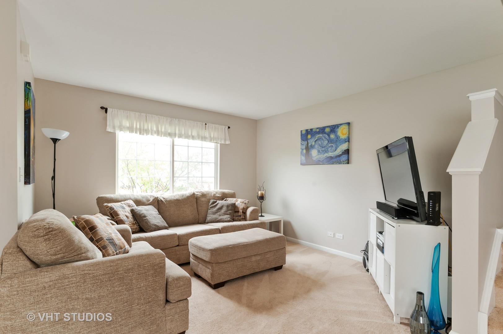 86 Amberly Drive Round Lake, IL 60073 - Photo 2 of 12 a living room with furniture and a flat screen tv