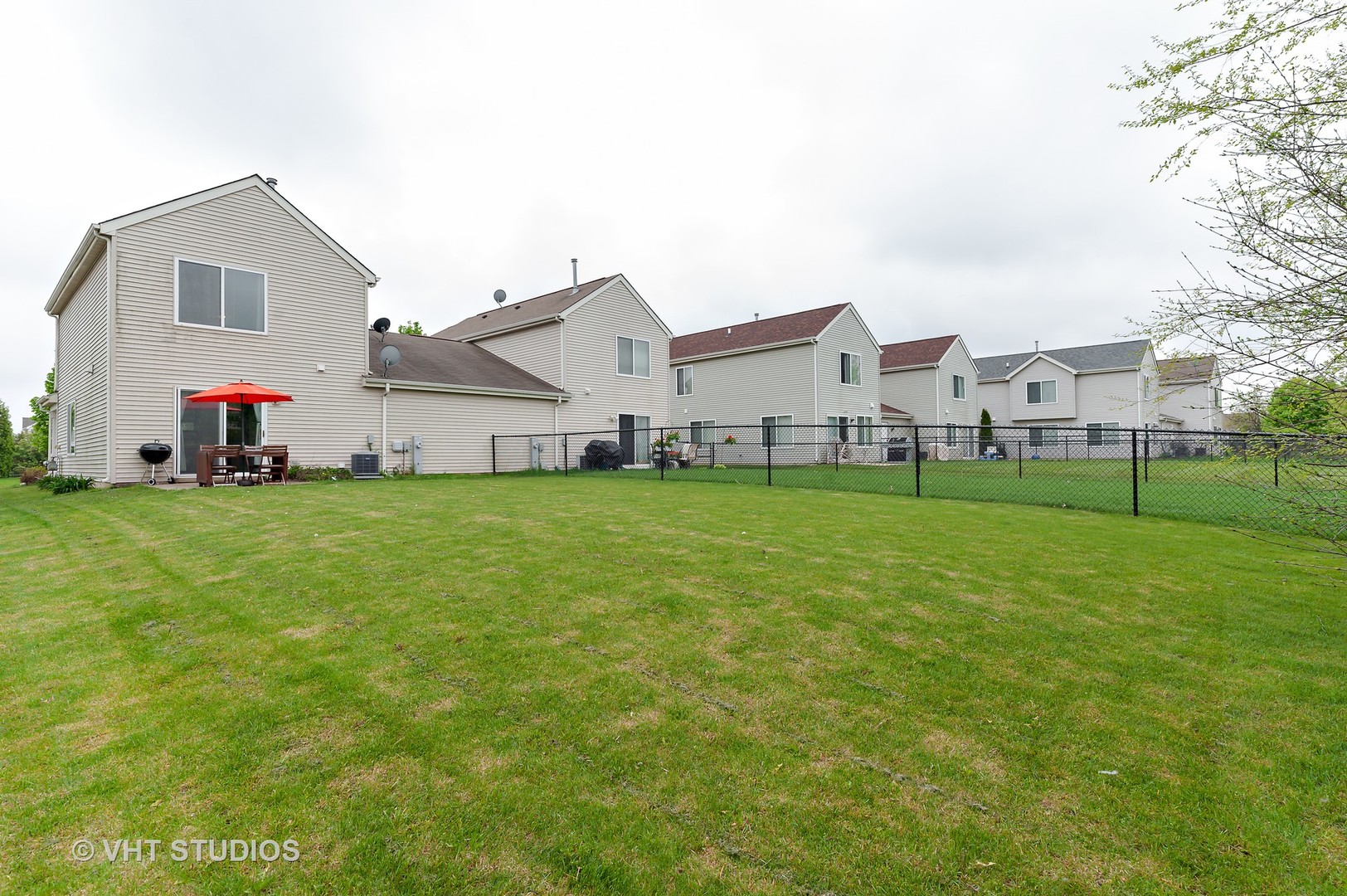86 Amberly Drive Round Lake, IL 60073 - Photo 11 of 12 a view of a house with a yard and garage
