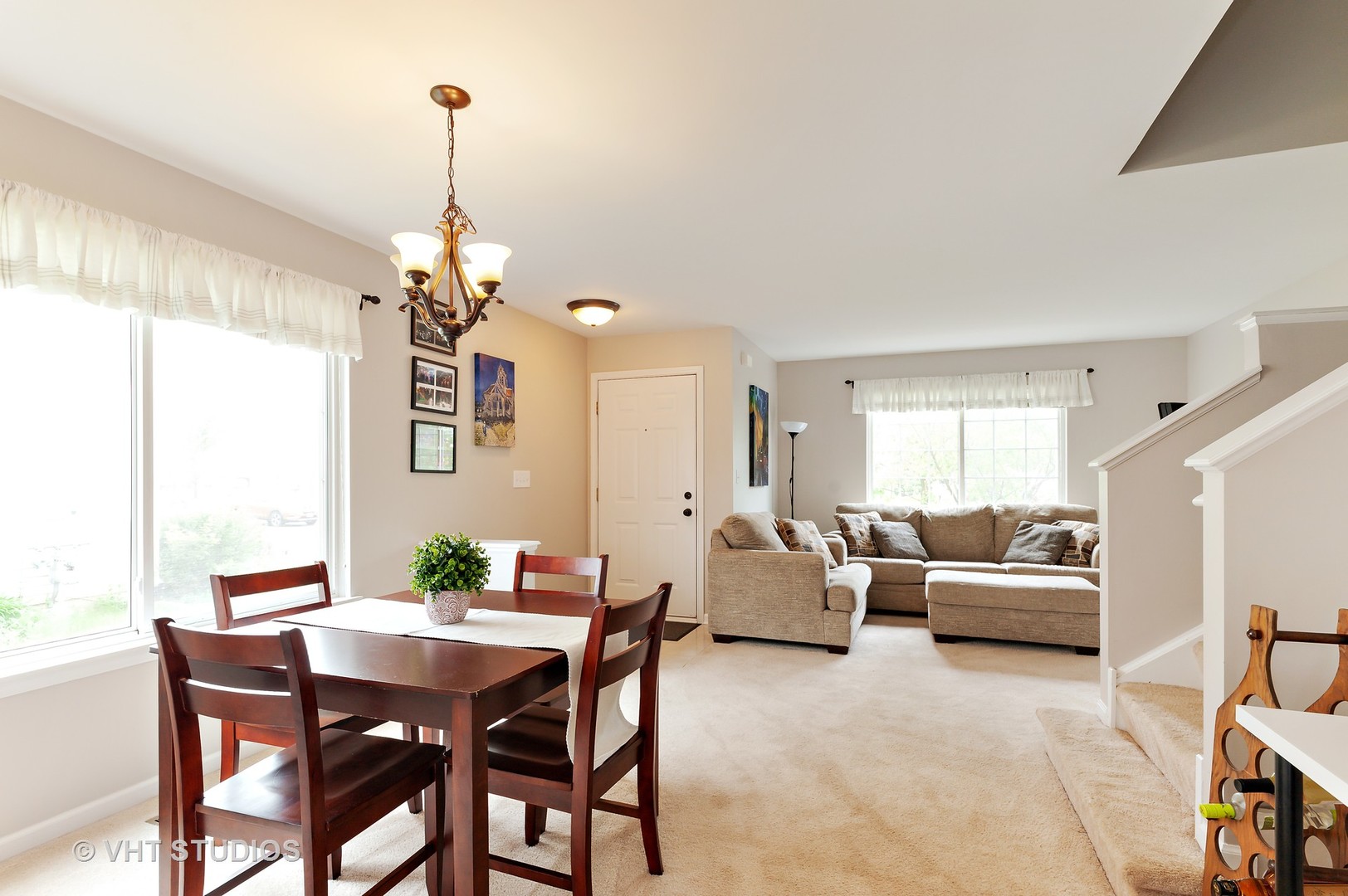 86 Amberly Drive Round Lake, IL 60073 - Photo 3 of 12 a view of a dining room with furniture wooden floor and chandelier