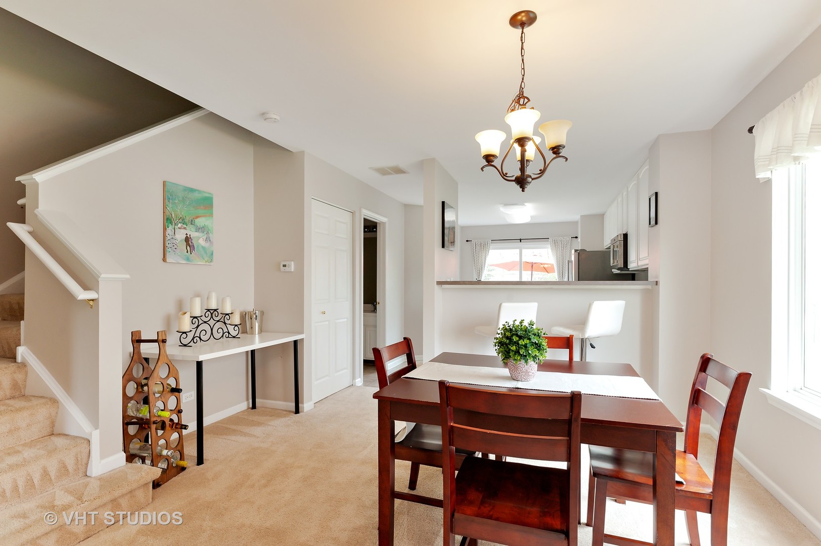 86 Amberly Drive Round Lake, IL 60073 - Photo 4 of 12 a view of a dining room with furniture and chandelier