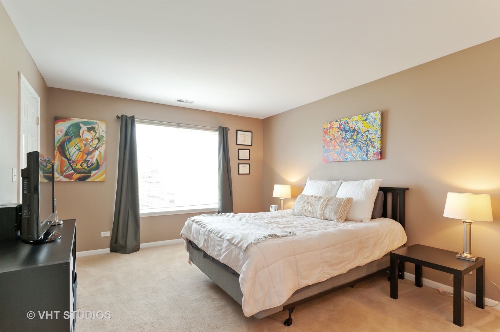 86 Amberly Drive Round Lake, IL 60073 - Photo 7 of 12 a bedroom with a bed and a flat tv screen on the dresser